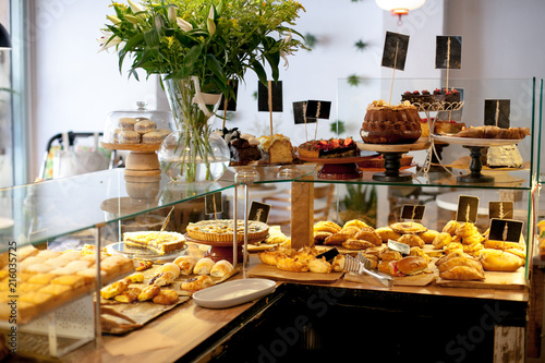 Modern display of bakery with different kinds of cookie and buns