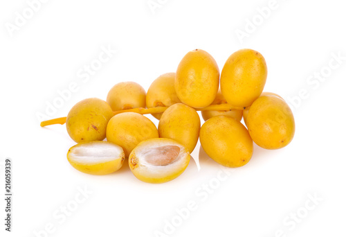 bunch of fresh yellow dates on white background