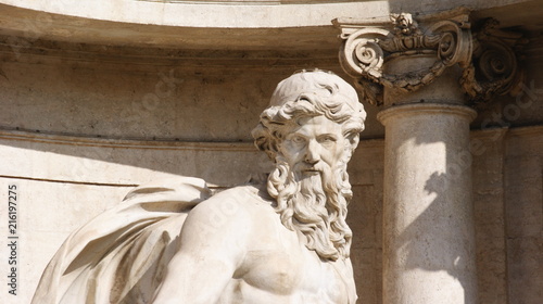 Detail of decorations and statues of the Fountain of TRevi on a sunny day