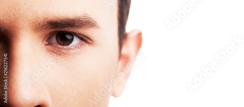 Photo of young brunette man eye