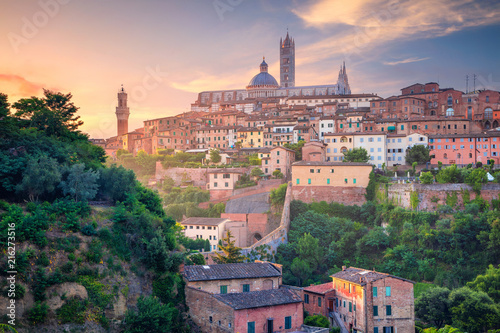 Siena. Cityscape aerial image of medieval city of Siena, Italy during sunrise.