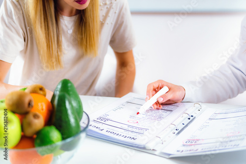 Nutritionist with female patient