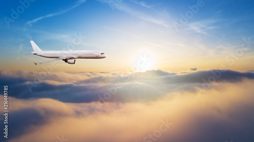 Detail of commercial airplane flying above clouds