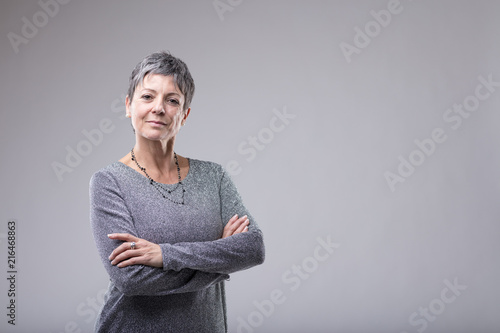 Confident businesswoman with folded arms