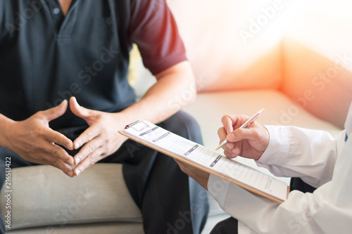 Urologist Doctor giving consult for prostate problems to patient. Urologic oncologists specialize in treating cancer of the urinary tract and male reproductive organs. Mens health problem concept.