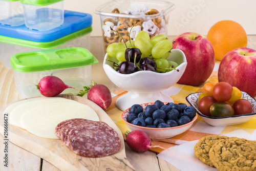 Preparation of school lunch.Cheese and salami and vegetables - ingredients for sandwiches.
