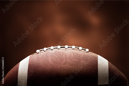 American football ball on background