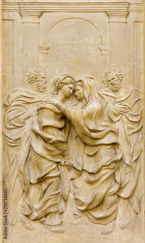 PARMA, ITALY - APRIL 17, 2018: The baroque relief of Visitation in church Chiesa di Santa Teresa with the four Evangelists by Domenico Reti from 17. cent.