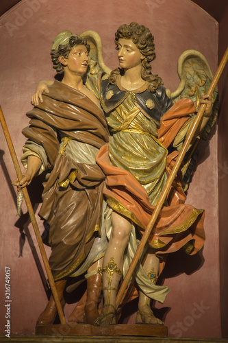 ZARAGOZA, SPAIN - MARCH 3, 2018: The polychome carved baroque satatue of Raphael archangel with the Tobias in church Iglesia de San Miguel de los Navarros.