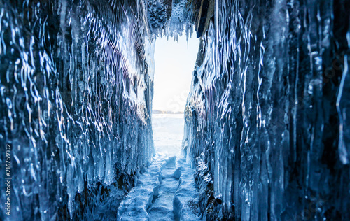 Winter Landscape, Frozen ice cave with bright sunlight from way out at lake Baikal in Irkutsk, Siberia, Russia