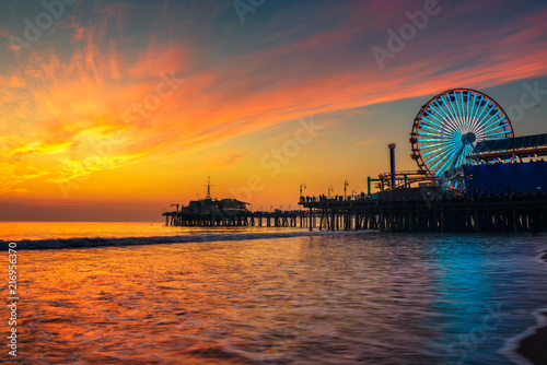 Visitors enjoy sunset above Santa Monica Pier in Los Angeles