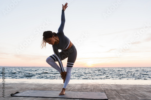 Portrait of a attractive young woman doing yoga