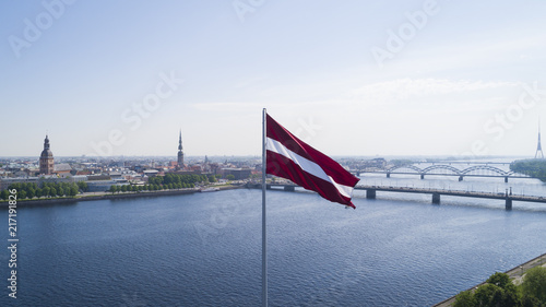 Panorama of Riga city with a big Latvian flag in foreground