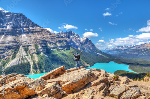 Hiker on Bow Summit overlooking Peyto Lake in Banff National Park