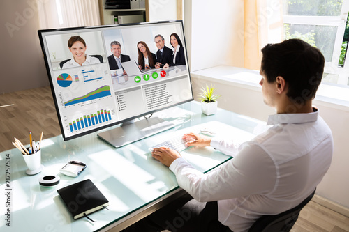 Businessman videoconferencing on computer