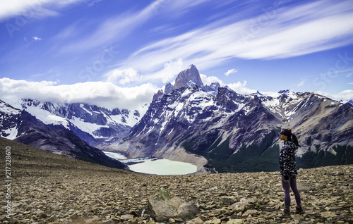 Woman hiker looking out at Mount Fitz Roy in El Chalten Argentina