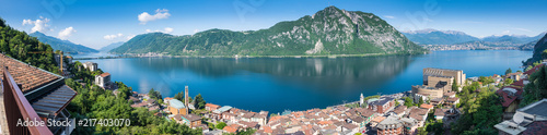 Lake Lugano. Panoramic view of Campione d'Italia, famous for its casino. In the background on the right the city of Lugano, in the middle Monte San Salvatore, on the left Melide and Monte San Giorgio