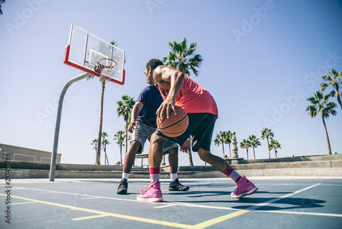 Friends playing basketball