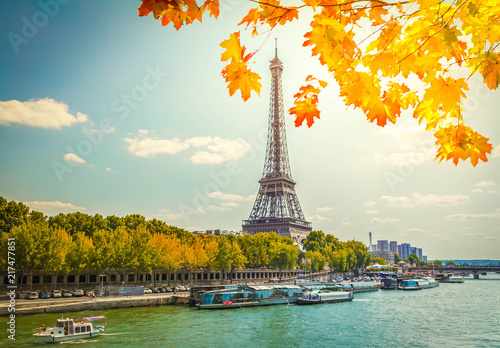 Eiffel Tour over water of Seine river at fall day, Paris, France