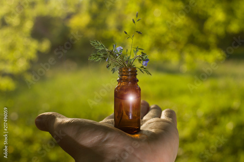 Alternative medicine - bottles & hand.