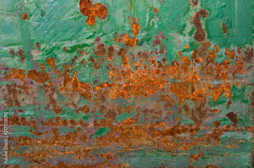 Peeling green paint and rust