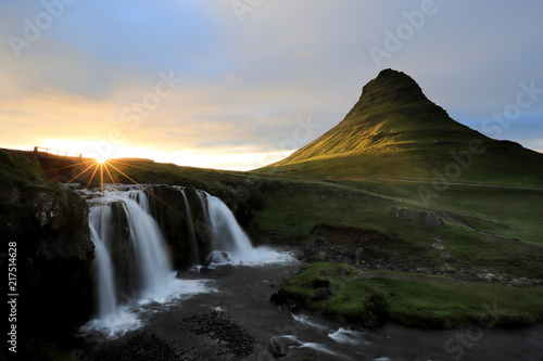 Famous Kirkjufell mountain and Kirkjufellsfoss at sunset on Snaefellsnes peninsula, Iceland summer