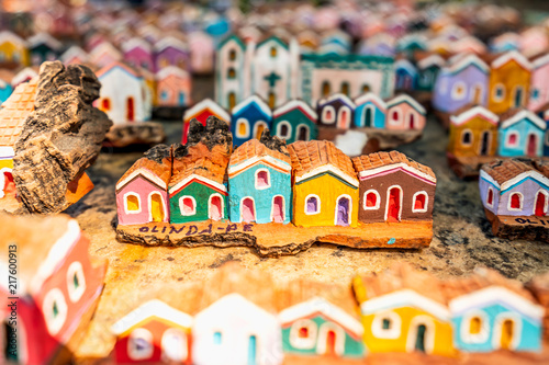 Olinda, Pernambuco, Brazil - JUL, 2018: Little wooden carvings representing the colorful houses and architecture of Olinda