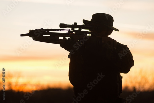 man with crossbow silhouette