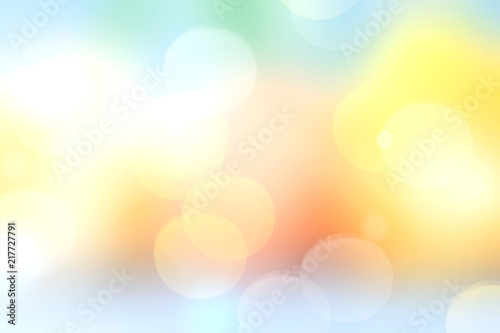 Soft yellow blurred bokeh background texture.