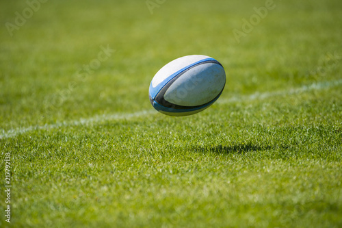 rugby ball over the grass in the stadium
