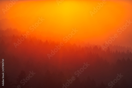 Smoke from the summer 2018 California wildfires glows under the setting sun