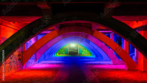 Colorful illuminated pathway under bridge underpass in Adelaide city