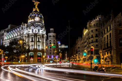 Night view of Metropolis Building and traffic light trails (Madrid, Spain)
