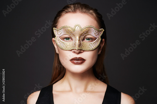 beautiful woman in golden mask