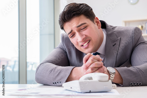 Businessman expecting important call on phone