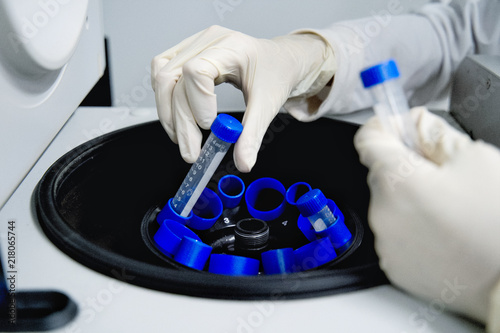 The researcher is using centrifuge tube 15 ml to do the lab test in the laboratory room.