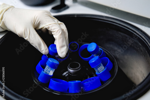 The researcher is using centrifuge tube 15 ml to do the lab test in the laboratory room.