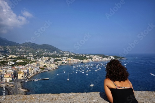 tourist woman admires ischia panorama