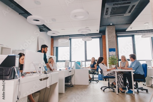 Business people showing teamwork in the office interior. Business concept. Teamwork.