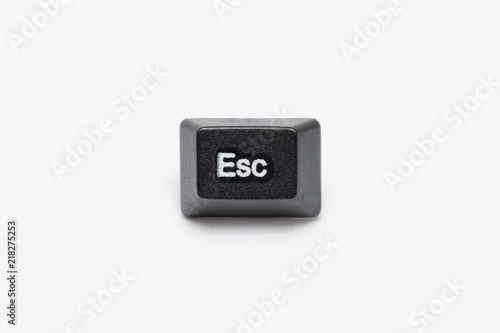 Single black keys of keyboard with different letters escape