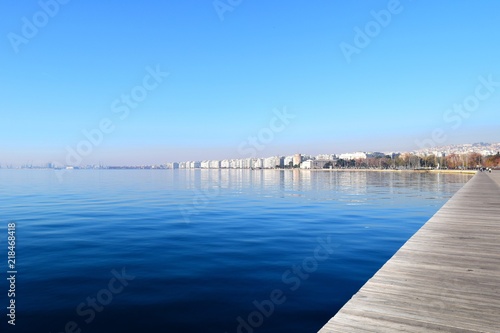 Wide shot of Thessaloniki seafront. Blue sea and White Tower background