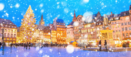 Christmas market under the snow in France, in Strasbourg, Alsace