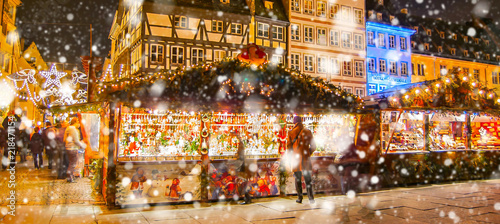 Christmas market under the snow in France, in Strasbourg, Alsace