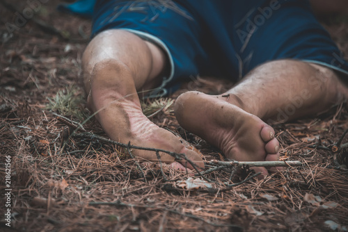 corpse of a man in the woods