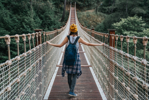 Happy travel woman on vacation concept. Funny traveler enjoy her trip and ready to adventure.