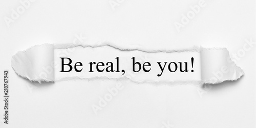 Be real, be you! on white torn paper