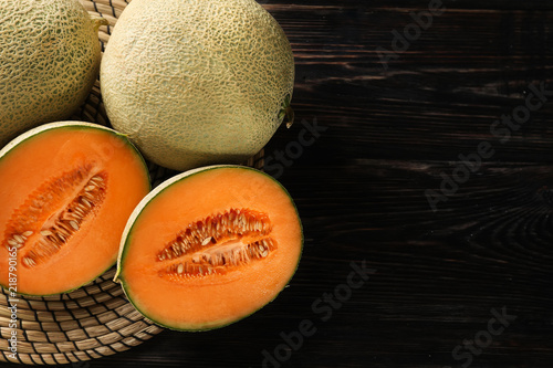 Ripe melons on wooden background