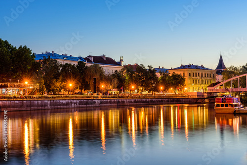 Cityscape of Tartu at night. The historical city center and the Emajogi river in the night, Tartu city, Estonia