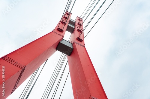 Red metal bridge tower