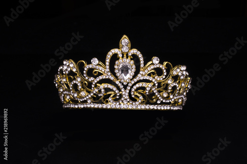 gold crown with diamonds isolated on black